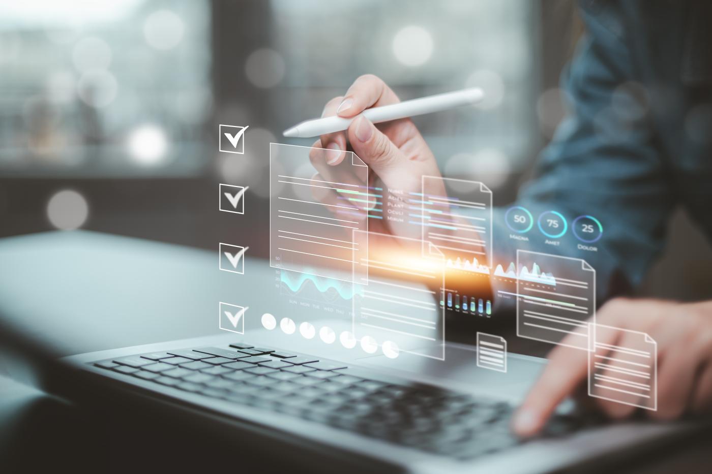 A futuristic image of a woman using a stylus on a digital display.
